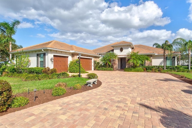 mediterranean / spanish-style home with a garage