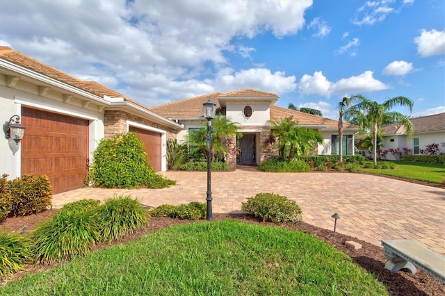 mediterranean / spanish-style home featuring a garage