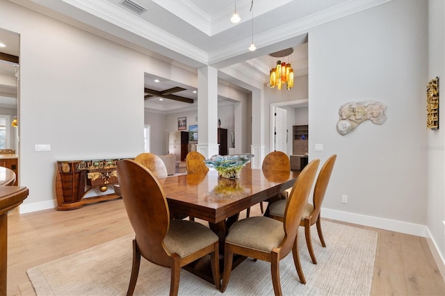 dining space with coffered ceiling, crown molding, light hardwood / wood-style flooring, a notable chandelier, and beam ceiling