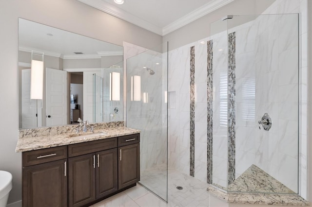 bathroom featuring tiled shower, vanity, and ornamental molding