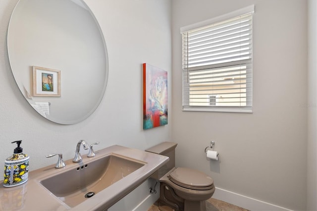 bathroom with toilet and sink