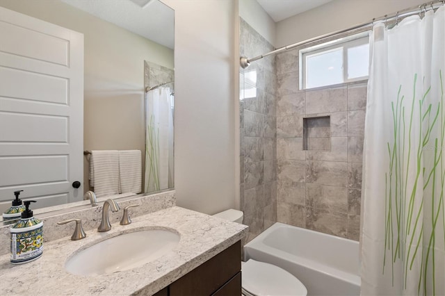 full bathroom featuring vanity, shower / bath combo, and toilet