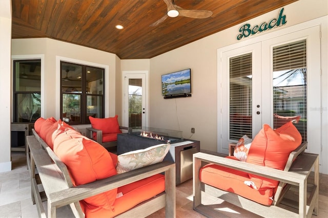 view of patio / terrace with an outdoor living space, french doors, and ceiling fan