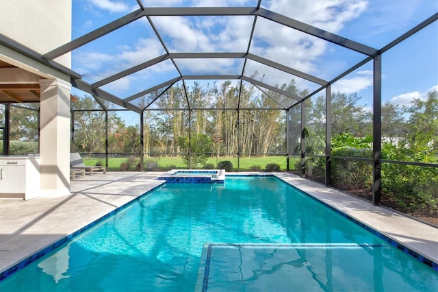 view of swimming pool featuring glass enclosure, a patio area, and an in ground hot tub