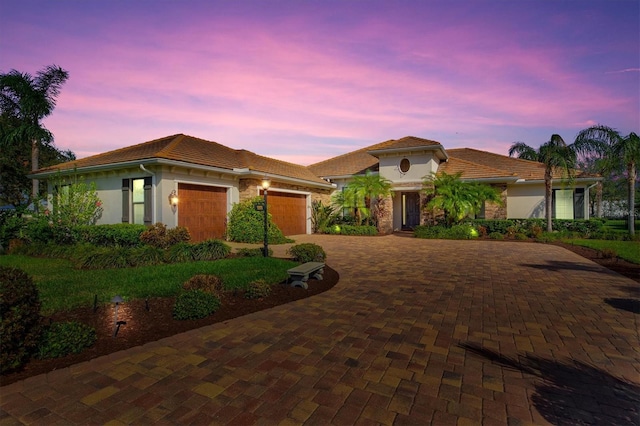 mediterranean / spanish house with a garage