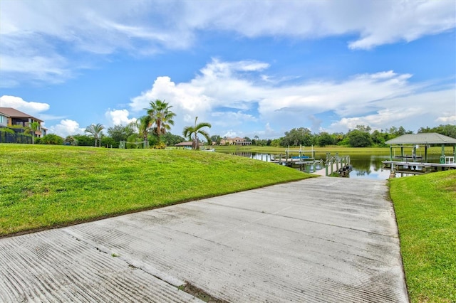 exterior space with a water view and a yard