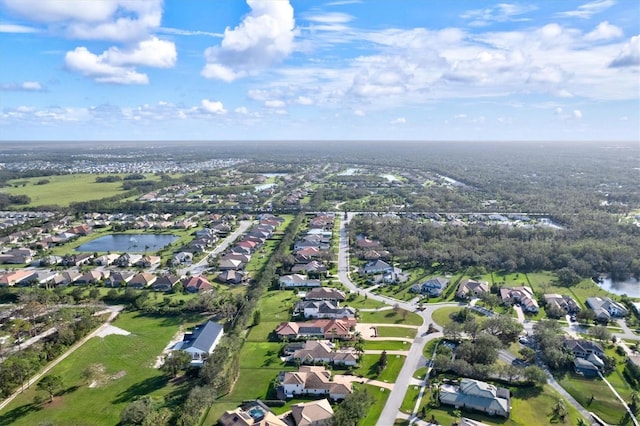 birds eye view of property featuring a water view and a residential view