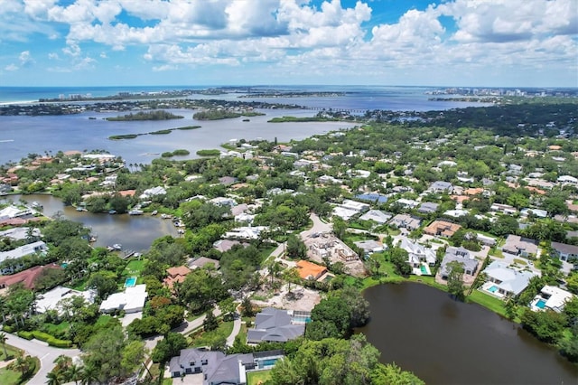 birds eye view of property with a water view and a residential view