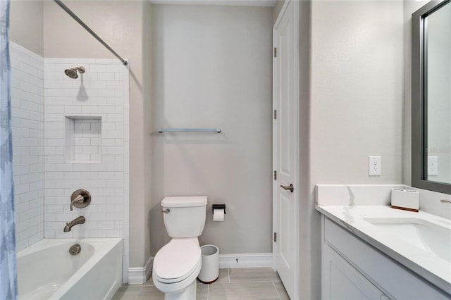 full bathroom with vanity, tiled shower / bath combo, and toilet