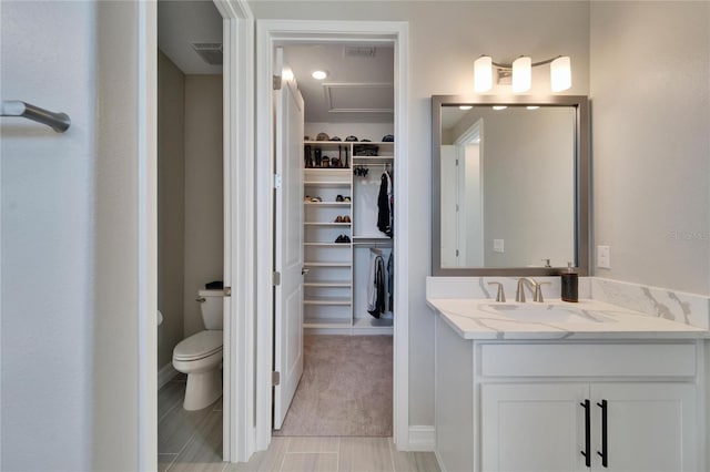 bathroom with vanity and toilet