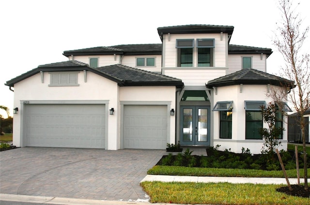 view of front of home featuring french doors and a garage