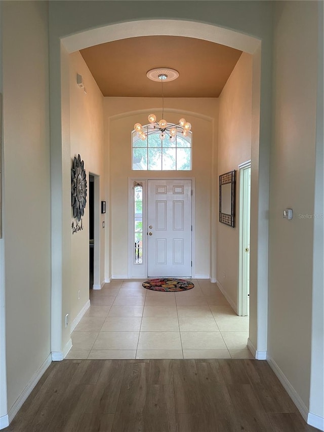 foyer featuring a notable chandelier and light wood-type flooring