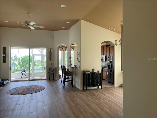 entrance foyer with light hardwood / wood-style flooring, plenty of natural light, and ceiling fan