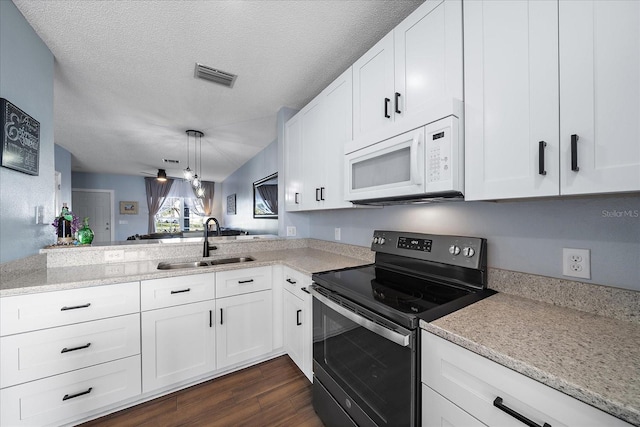 kitchen featuring sink, stainless steel range with electric stovetop, kitchen peninsula, white cabinetry, and dark hardwood / wood-style floors