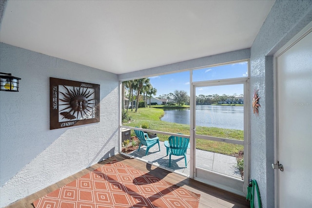 sunroom with a water view