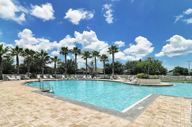 view of swimming pool with a patio area