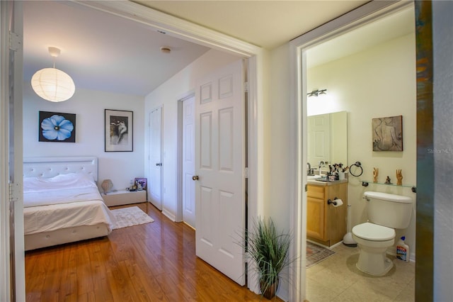 bedroom with light wood-type flooring