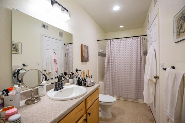 full bathroom with vanity, toilet, tile patterned flooring, and shower / tub combo with curtain