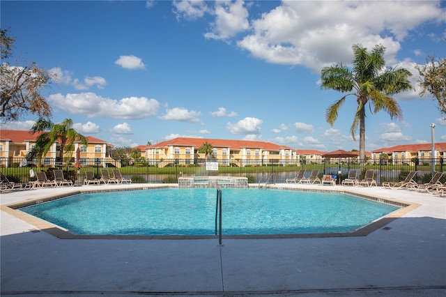 view of swimming pool with a patio