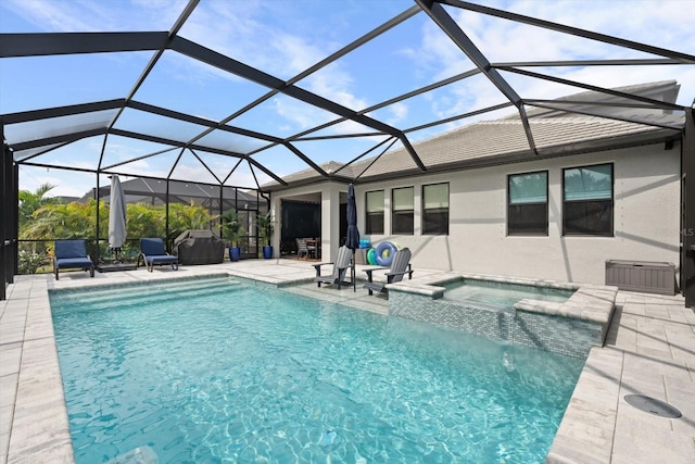 view of pool with a lanai, an in ground hot tub, and a patio area