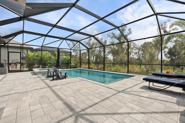 view of pool featuring a lanai and a patio area