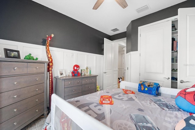 bedroom featuring ceiling fan and a closet