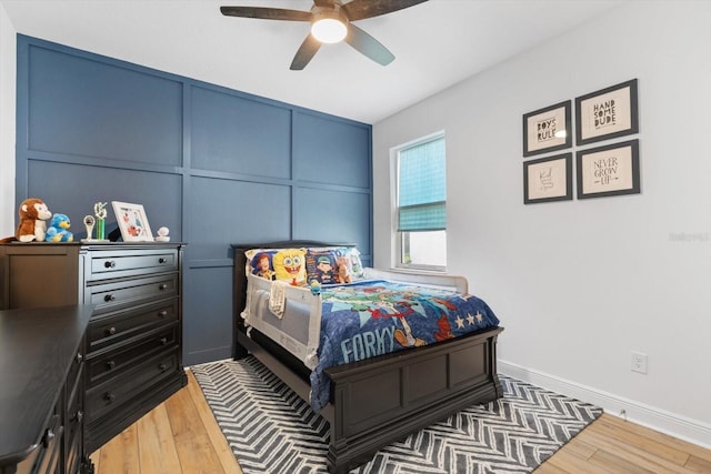 bedroom with dark wood-type flooring and ceiling fan