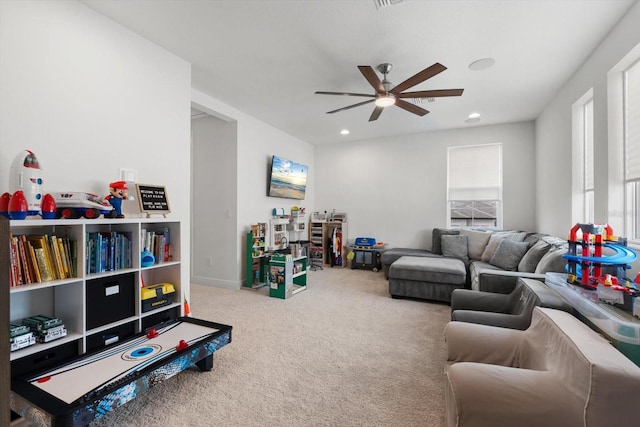 playroom with carpet flooring and ceiling fan