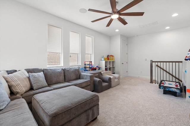 living room with carpet and ceiling fan