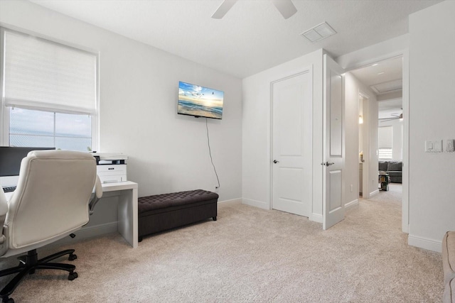 office featuring ceiling fan and light carpet