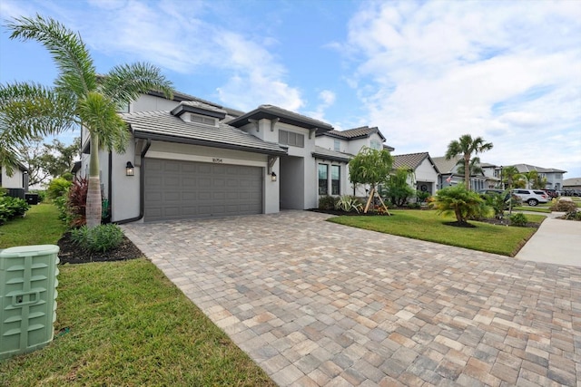 view of front facade with a garage and a front yard