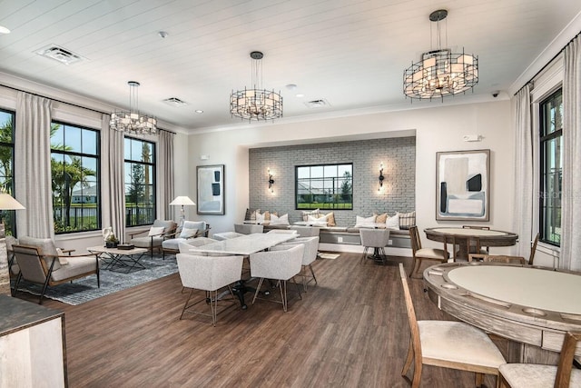 dining room with dark wood-type flooring, wooden ceiling, an inviting chandelier, and ornamental molding