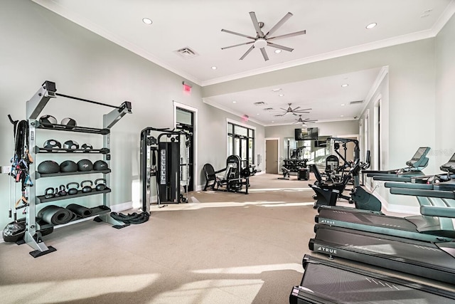 workout area featuring ceiling fan and ornamental molding