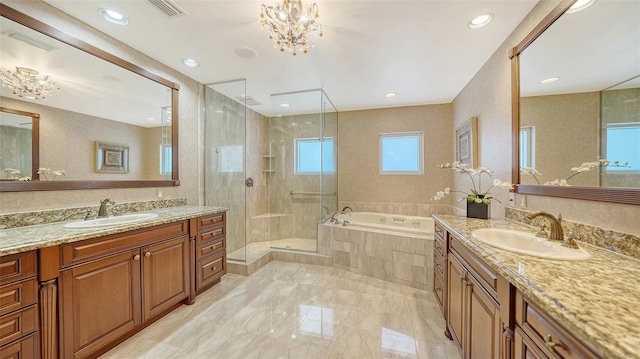 bathroom with vanity, shower with separate bathtub, an inviting chandelier, and plenty of natural light