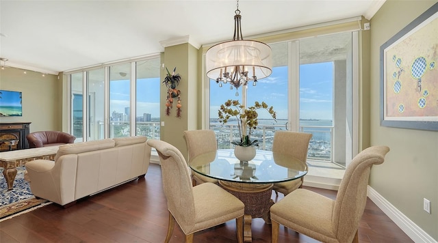 dining room featuring ornamental molding, dark hardwood / wood-style floors, and plenty of natural light