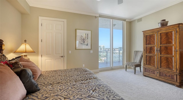 carpeted bedroom featuring ceiling fan, crown molding, and access to exterior