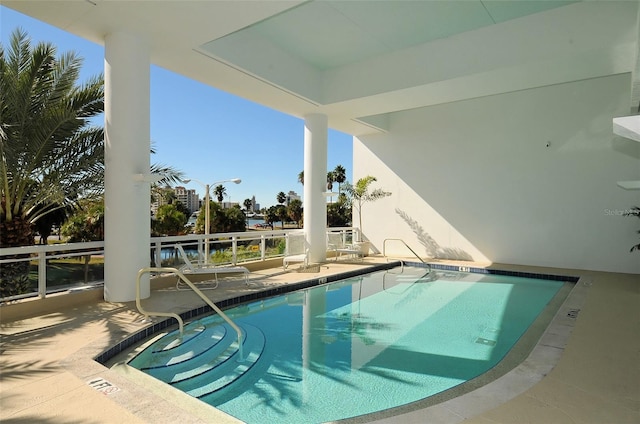 view of swimming pool featuring a patio area