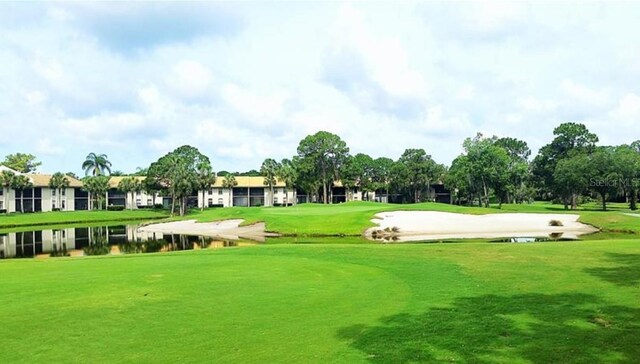 view of home's community featuring a yard and a water view