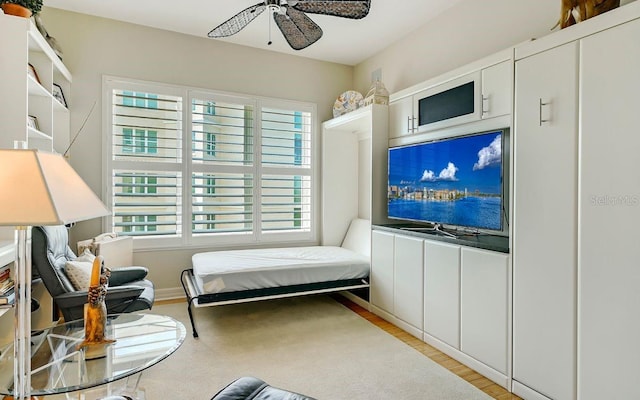 bedroom with ceiling fan and wood finished floors