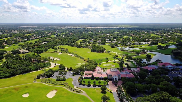 birds eye view of property with a water view and golf course view