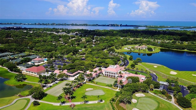 drone / aerial view featuring a water view and view of golf course