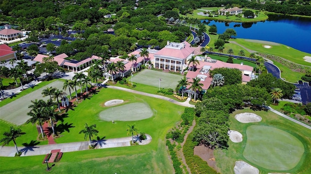 aerial view featuring a water view and golf course view