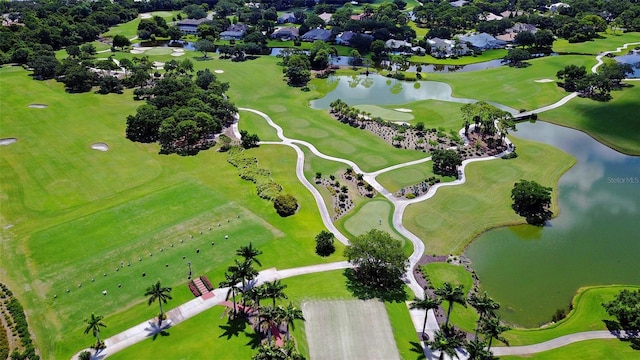 aerial view featuring view of golf course and a water view