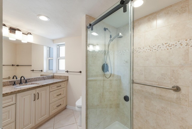 bathroom with vanity, toilet, and walk in shower