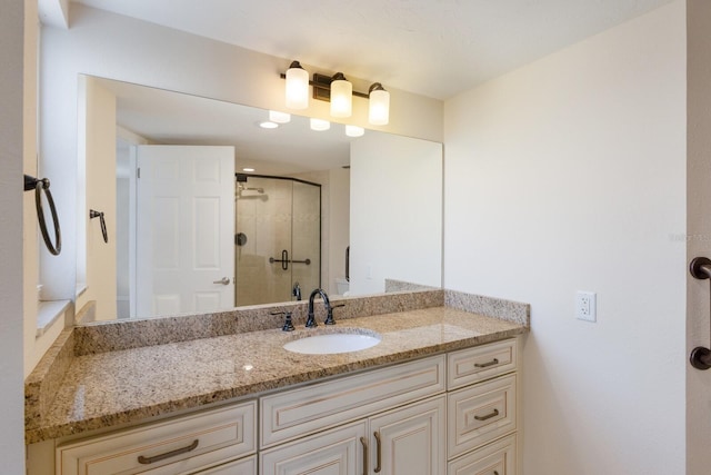 bathroom with vanity and walk in shower