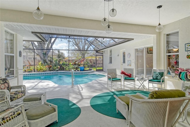 view of pool featuring a patio area and a lanai