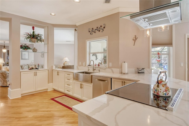 kitchen featuring dishwasher, light hardwood / wood-style flooring, ornamental molding, sink, and light stone counters