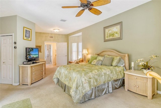 bedroom featuring ceiling fan and light carpet