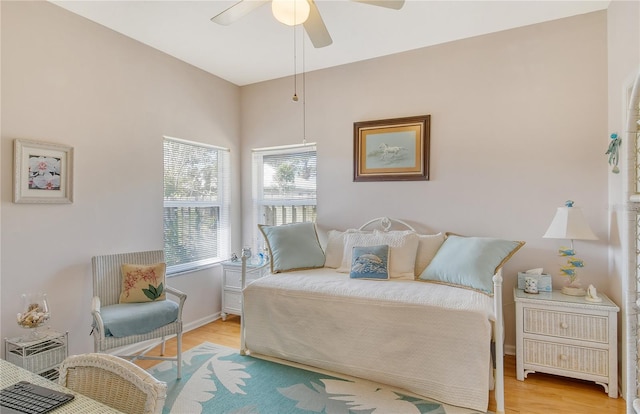 bedroom with ceiling fan and light wood-type flooring