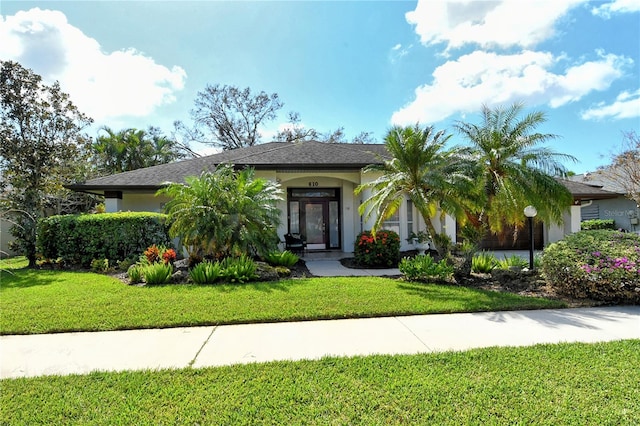 view of front of home with a front lawn